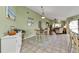Bright dining area with a wooden table and chairs, located near the kitchen at 18491 Hottelet Cir, Port Charlotte, FL 33948