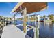 Covered boat lift on private dock at 18491 Hottelet Cir, Port Charlotte, FL 33948