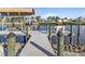 Private dock with lift and seating area, perfect for enjoying the waterfront at 18491 Hottelet Cir, Port Charlotte, FL 33948