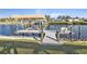 Private backyard dock with covered boat lift and seating at 18491 Hottelet Cir, Port Charlotte, FL 33948