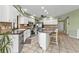 Open concept kitchen with stainless steel appliances and an island at 18491 Hottelet Cir, Port Charlotte, FL 33948