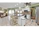 Island kitchen with stainless steel appliances and white cabinetry at 18491 Hottelet Cir, Port Charlotte, FL 33948