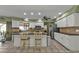 Spacious kitchen with island, stainless steel appliances, and white cabinets at 18491 Hottelet Cir, Port Charlotte, FL 33948