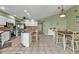 Eat-in kitchen with island, white cabinets, and stainless steel appliances at 18491 Hottelet Cir, Port Charlotte, FL 33948