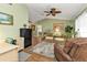 Living room with comfy seating, hardwood floors, and a home office area at 18491 Hottelet Cir, Port Charlotte, FL 33948
