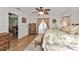 Main bedroom with king bed, wooden dresser and access to the bathroom at 18491 Hottelet Cir, Port Charlotte, FL 33948