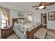 Spacious main bedroom with a king-size bed and access to the bathroom at 18491 Hottelet Cir, Port Charlotte, FL 33948
