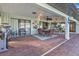 Outdoor patio with seating, grill, and string lights at 18491 Hottelet Cir, Port Charlotte, FL 33948