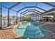 Relaxing screened pool with brick deck at 18491 Hottelet Cir, Port Charlotte, FL 33948
