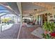 Brick patio with string lights and pool access at 18491 Hottelet Cir, Port Charlotte, FL 33948