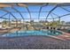 Enclosed pool and patio area with canal views at 18491 Hottelet Cir, Port Charlotte, FL 33948