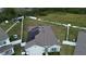Aerial view showing a house with solar panels and a large backyard at 2201 Grand Flora Trl, Bradenton, FL 34208