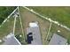 Aerial view of a house with a backyard patio and surrounding homes at 2201 Grand Flora Trl, Bradenton, FL 34208