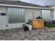 Backyard with hurricane shutters and patio furniture at 2201 Grand Flora Trl, Bradenton, FL 34208