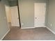 Simple bedroom with two closets and neutral walls at 2201 Grand Flora Trl, Bradenton, FL 34208
