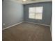 Spacious bedroom with neutral walls and carpet flooring at 2201 Grand Flora Trl, Bradenton, FL 34208