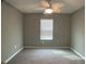 Bedroom with ceiling fan and grey walls at 2201 Grand Flora Trl, Bradenton, FL 34208