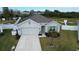 House exterior with two-car garage and landscaped yard at 2201 Grand Flora Trl, Bradenton, FL 34208