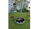 Well-maintained front yard with flowering plants and decorative lighting at 2201 Grand Flora Trl, Bradenton, FL 34208