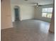 Large living room with tile flooring and plenty of natural light at 2201 Grand Flora Trl, Bradenton, FL 34208