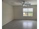 Bright and airy living room with large window and ceiling fan at 2201 Grand Flora Trl, Bradenton, FL 34208