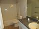 Bathroom featuring a shower-tub combo, a sink with counter space, and a large mirror at 2410 Lanier Rd, Punta Gorda, FL 33982