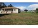 Beautiful single-Gathering home featuring a well-manicured lawn and inviting front porch at 2410 Lanier Rd, Punta Gorda, FL 33982