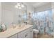 Bright bathroom featuring a shower/tub combo and updated vanity at 25386 Saint Helena Ln, Punta Gorda, FL 33983