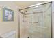 Clean bathroom with a walk-in shower and tiled walls at 3256 White Ibis Ct # 22A, Punta Gorda, FL 33950