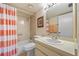 Clean bathroom with shower/tub combo and updated vanity at 3256 White Ibis Ct # 22A, Punta Gorda, FL 33950