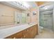 Bathroom with double vanity and walk-in shower at 3256 White Ibis Ct # 22A, Punta Gorda, FL 33950