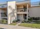 Condo building exterior featuring a walkway and landscaping at 3256 White Ibis Ct # 22A, Punta Gorda, FL 33950