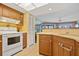 Bright kitchen features white appliances and wood cabinets at 3256 White Ibis Ct # 22A, Punta Gorda, FL 33950