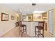 Kitchen features a breakfast bar and light wood cabinets at 3256 White Ibis Ct # 22A, Punta Gorda, FL 33950