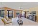Living area with canal views, tiled floors, and comfortable seating at 3256 White Ibis Ct # 22A, Punta Gorda, FL 33950