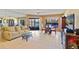 Living room with canal views, tiled floors, and comfortable seating at 3256 White Ibis Ct # 22A, Punta Gorda, FL 33950