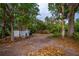 Backyard with shed and mature trees at 4485 Herder St, Port Charlotte, FL 33948
