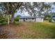 Backyard with shed and mature trees at 4485 Herder St, Port Charlotte, FL 33948