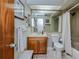 Bathroom with shower, toilet and wooden vanity at 4485 Herder St, Port Charlotte, FL 33948