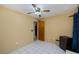 Bedroom with tiled floors and ceiling fan at 4485 Herder St, Port Charlotte, FL 33948