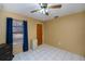 Simple bedroom with tiled floors and window at 4485 Herder St, Port Charlotte, FL 33948