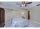 Bedroom with tiled floors, ceiling fan, and floral bedding at 4485 Herder St, Port Charlotte, FL 33948