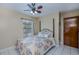 Bright bedroom with a floral bedspread and tiled floors at 4485 Herder St, Port Charlotte, FL 33948