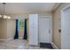 Bright dining area with tile floor, window and white cabinets at 4485 Herder St, Port Charlotte, FL 33948