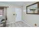 Clean entryway with tile flooring, a mirror, and neutral color scheme at 4485 Herder St, Port Charlotte, FL 33948
