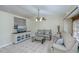 Bright living room with vaulted ceilings, comfy sofas, and a large TV at 4485 Herder St, Port Charlotte, FL 33948