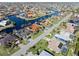 Aerial view of canal-front community, showcasing homes and landscaping at 5301 Almar Dr, Punta Gorda, FL 33950