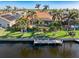 Backyard oasis with pool, dock, and lush landscaping at 5301 Almar Dr, Punta Gorda, FL 33950