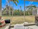 Relaxing screened patio with backyard view and seating at 1796 Scarlett Ave, North Port, FL 34289