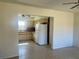 A view into the kitchen from a living space, displaying the vintage cabinets and appliances at 30431 Holly Rd, Punta Gorda, FL 33982